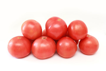 pink tomatoes on white background. vegetables