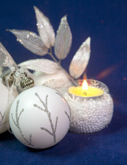 white New Year balls and tinsel on a blue background