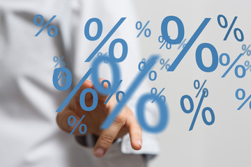 hand touches virtual percent icon