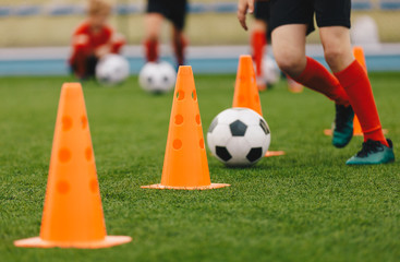 Soccer Training Drill. Football Player Running With Ball. Soccer Athletes Participate in Soccer Practice Drills. Sports Education Background