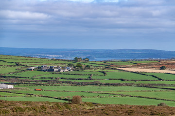 Fototapeta na wymiar The view of the beautiful Cornish countryside from Chapel Carn Brea