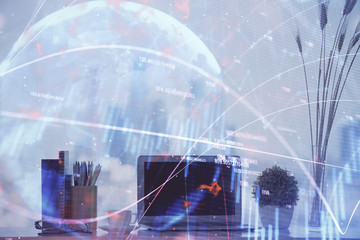 Stock market graph and table with computer background. Double exposure. Concept of financial analysis.