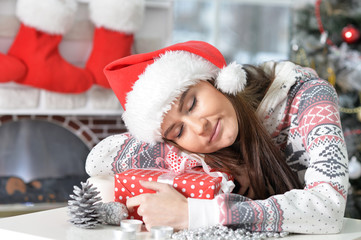 Portrait of smiling woman with Christmas gift