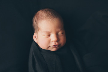 the concept of healthy lifestyle, IVF - a newborn baby sleeps under a blanket.