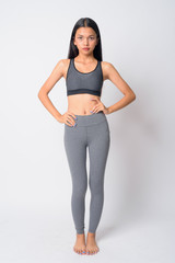 Full body shot of young Asian woman ready for gym