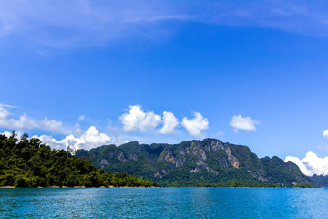 Landscape of mountains with cloud,blue sky and Lake. ratchaprapa dam. suratthani, Thailand