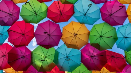 Colorful umbrellas hung over the streets of Agueda, Portugal.