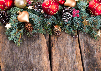 Christmas decoration on wooden background with free space. Celebration balls and other decoration.