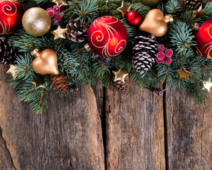 Fototapeta na wymiar Christmas decoration on wooden background with free space. Celebration balls and other decoration.