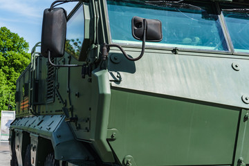 the front part of the cabin of a modern all-terrain vehicle for transporting soldiers during the battle, protecting them with thick armor