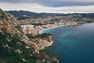 Aerial photo to salt lake and Mediterranean Seascape, Calpe or Calp resort spanish town, top view from Penon de Ifach or Penyal d'Ifac limestone huge rock located at Natural Park, Costa Blanca, Spain