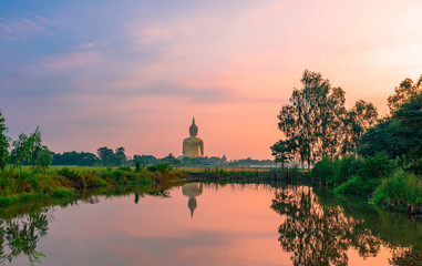 Fototapeta na wymiar Sunrise at Big Buddha statue at Wat Muang, Ang Thong Province, Thailand.