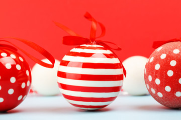 Christmas balls on red background, closeup