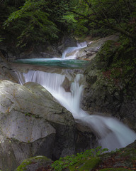 Obraz premium Nishizawa Valley in summer with waterfall in Chichibu-Tama-Kai National Park in Yamanashi prefecture.