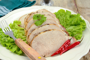 roast pork in the fillet on a plate