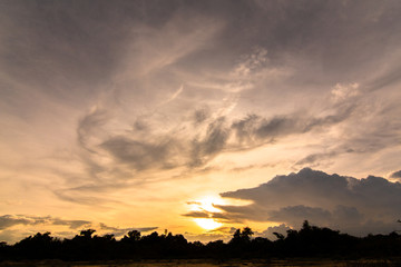 The clouds of black rain gathered in the evening. And evening light in Thailand