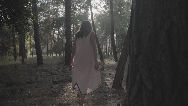 young woman running in the forest, s-log ungraded
