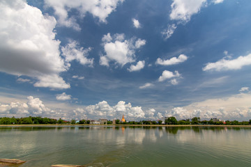 Naklejka premium The clouds reflect the water surface during the rainy season in Thailand.