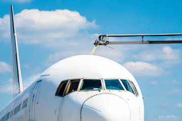 Fototapeta premium De-icing aircraft in airport
