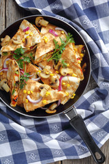 sliced quesadilla with chicken, tomato, sweet corn
