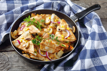 sliced quesadilla with chicken, tomato, sweet corn