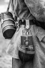 Water bottle on the belt of a German soldier from the Wehrmacht from the Second World War. Black and white photography