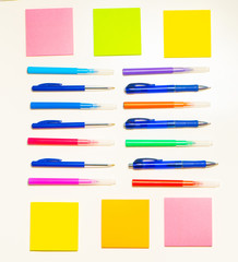 Colorful felt-tip pens on the white background. Markers and stickers pattern. Background or texture.