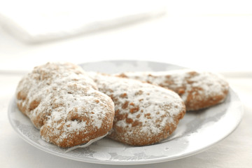 chocolate pastries cookies and a plate on a white table cloth with copy space for your text
