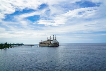 Large ships anchored on the beach