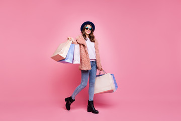 Full length photo of pretty youngster lady carry many packs shopper enjoy abroad sales mall wear...