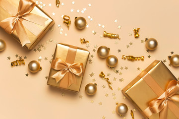 Merry Christmas and Happy Holidays greeting card. Beautiful golden gift balls ribbons confetti...