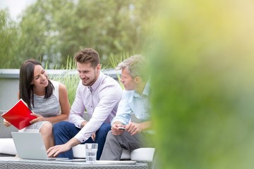 Business poeple planning and discussing plans before meeting in office rooftop