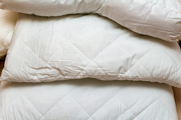 Fototapeta na wymiar pack of bedclothes linens blanket, pillows, sheets, bedding, bedsheet