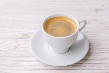 espresso coffee in white Cup white wooden menu background