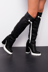 black boots woman autumn winter fashion, legs only, close up, legs up, on white background