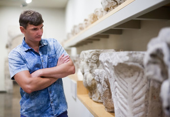 Man looking at exhibits in Ancient Greek hall