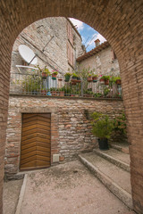 Fototapeta na wymiar Arch in the historic center of Fossato di Vico in Umbria