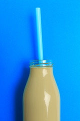 colorful bottle with straw on color background . Minimalism concept - Image