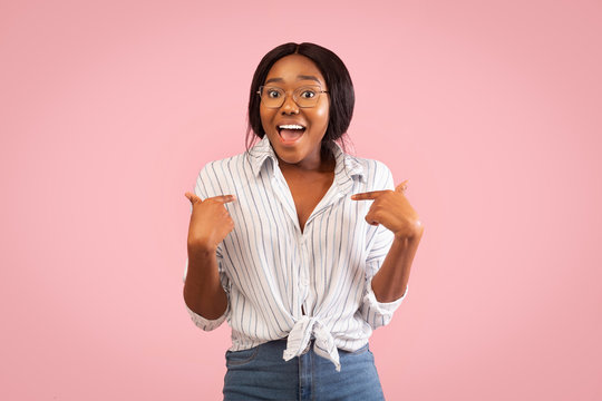 Black Girl Pointing Fingers At Herself Smiling Standing, Studio Shot