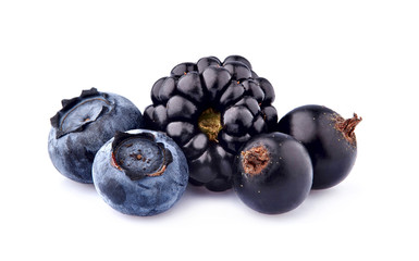 Black currant berries with blueberries  and blackberries on White Background isolated.