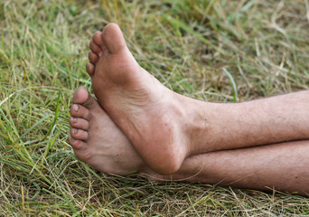 Bare feet of a man on the grass