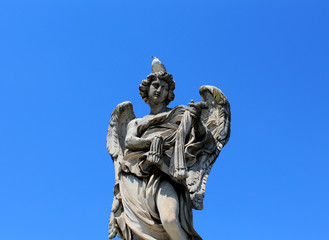 One of the ten angels statue on St. Angel bridge in Rome