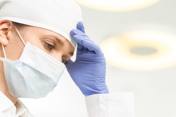 Pressured surgeon in clinic