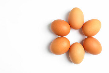 Flat lay composition with chicken eggs on color  background, space for text