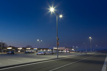 Fototapeta na wymiar modern parking area at night with led street lights