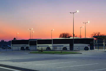 modern small bus station in the evening light with modern Led streetlights