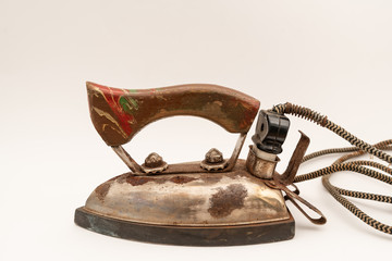 Old iron isolated on white background. Vintage rusty iron