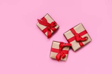 gift boxes with red bows, gift for New Year and Christmas. isolate on pink background copy space. layout