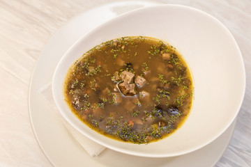 mushroom soup with meat and olives