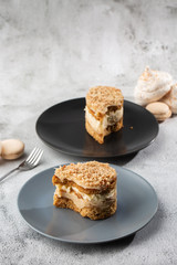 Banana or nut cake on gray plate on marble background. Selective focus. Vertical photo. Menu for bakery. cafe menu. Pastry. Delicious and sweet dessert at cafe restaurant.